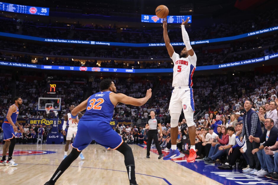 Malik Beasley #5 of the Detroit Pistons shoots the ball against Karl-Anthony Towns #32 of the New York Knicks during the second quarter in Game Three of the Eastern Conference First Round NBA Playoffs at Little Caesars Arena on April 24, 2025 in Detroit, Michigan.