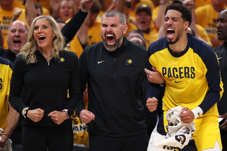 Tyrese Haliburton reacts from the bench with assistant coaches Jenny Boucek and Mike Weinar
