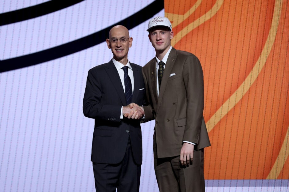 Kasparas Jakučionis (R) shakes hands with NBA commissioner Adam Silver (L) after being drafted twentieth overall by the Miami Heat during the first round of the 2025 NBA Draft at Barclays Center on June 25, 2025 in the Brooklyn