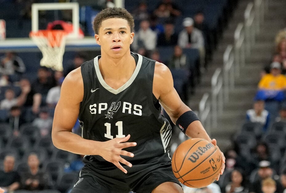 Carter Bryant #11 of the San Antonio Spurs dribbles the ball up