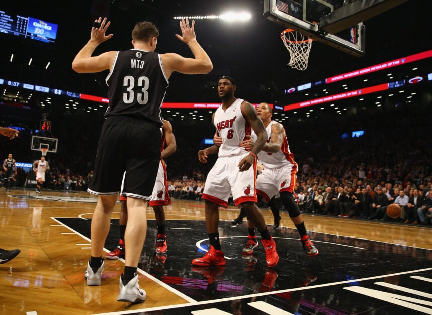LeBron James #6 of the Miami Heat goes after Mirza Teletovic #33 of the Brooklyn Nets after he was fouled during their game at the Barclays Center on January 10, 2014 in New York City.