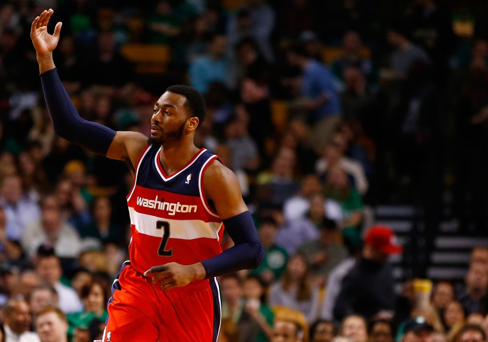BOSTON, MA - APRIL 16: John Wall #2 of the Washington Wizards reacts following a three-point shot against the Boston Celtics in the second quarter during the game at TD Garden on April 16, 2014 in Boston, Massachusetts. NOTE TO USER: User expressly acknowledges and agrees that, by downloading and or using this photograph, User is consenting to the terms and conditions of the Getty Images License Agreement. (Photo by Jared Wickerham/Getty Images)