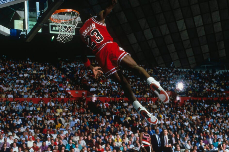 Michael Jordan dunking the ball for the Chicago Bulls in the 1980s.
