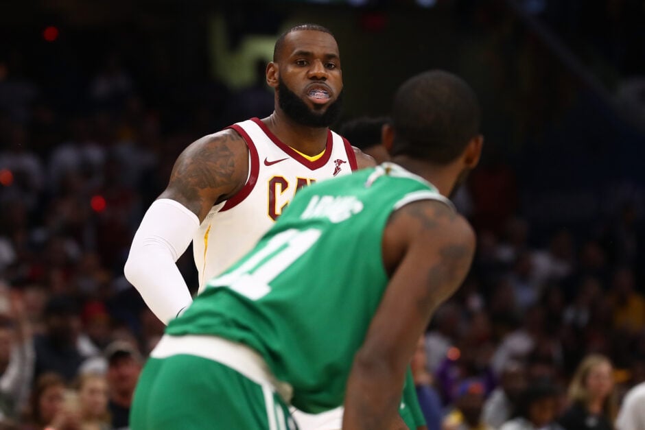 Kyrie Irving while playing for the Boston Celtics going against the LeBron James-led Cleveland Cavaliers, Irving's former team.