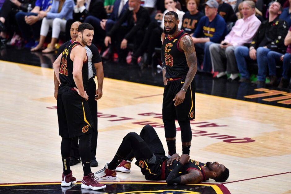 Larry Nance Jr. #22 and LeBron James #23 of the Cleveland Cavaliers looks on after Jeff Green #32 was shaken up the first quarter against the Golden State Warriors during Game Three of the 2018 NBA Finals at Quicken Loans Arena on June 6, 2018 in Cleveland, Ohio.