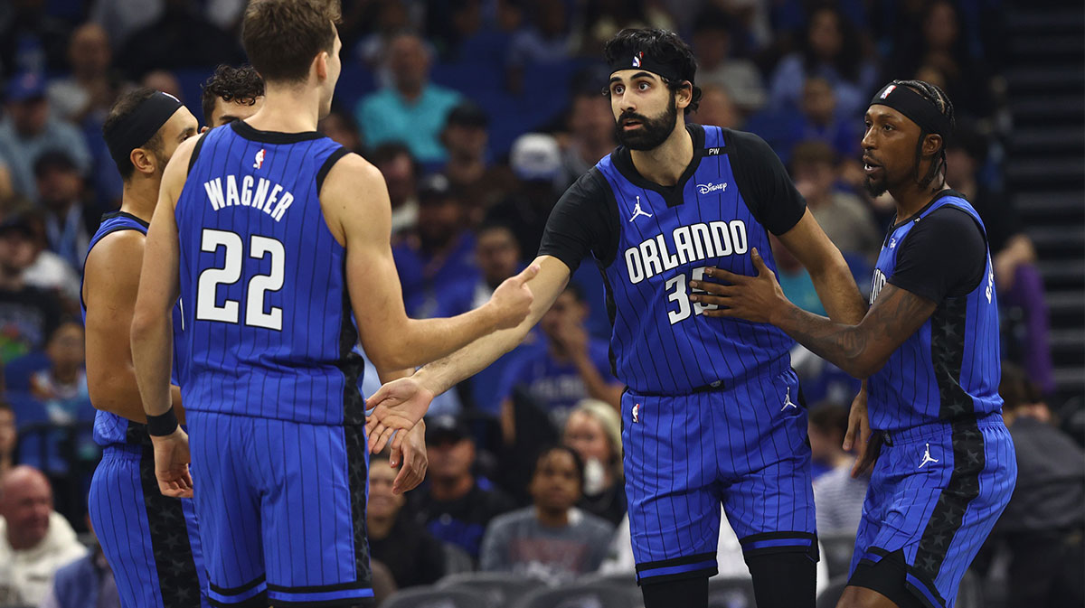 Orlando Magic center Goga Bitadze (35) is congratulated by forward Franz Wagner (22)and teammates against the Charlotte Hornets during the first quarter at Kia Center.