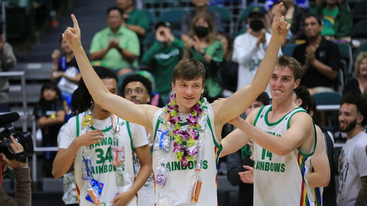 Hawaii forward Gytis Nemeiksa, middle, went through senior night ceremonies after a win over UC Davis on March 1.