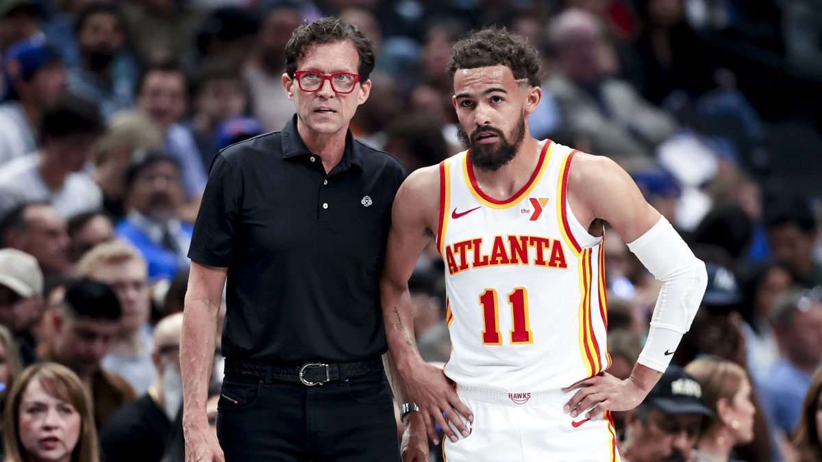 Atlanta Hawks head coach Quin Snyder speaks with Atlanta Hawks guard Trae Young (11) during the first half against the Dallas Mavericks at American Airlines Center. 