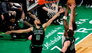 Boston Celtics guard Derrick White (No. 9) blocked a shot by New York Knicks forward OG Anunoby (No. 8) during an NBA Eastern Conference semifinal against the New York Knicks at TD Garden in May.