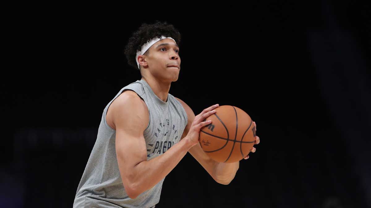 Indiana Pacers forward Enrique Freeman (8) warms up on the court before the game against the Atlanta Hawks at State Farm Arena.