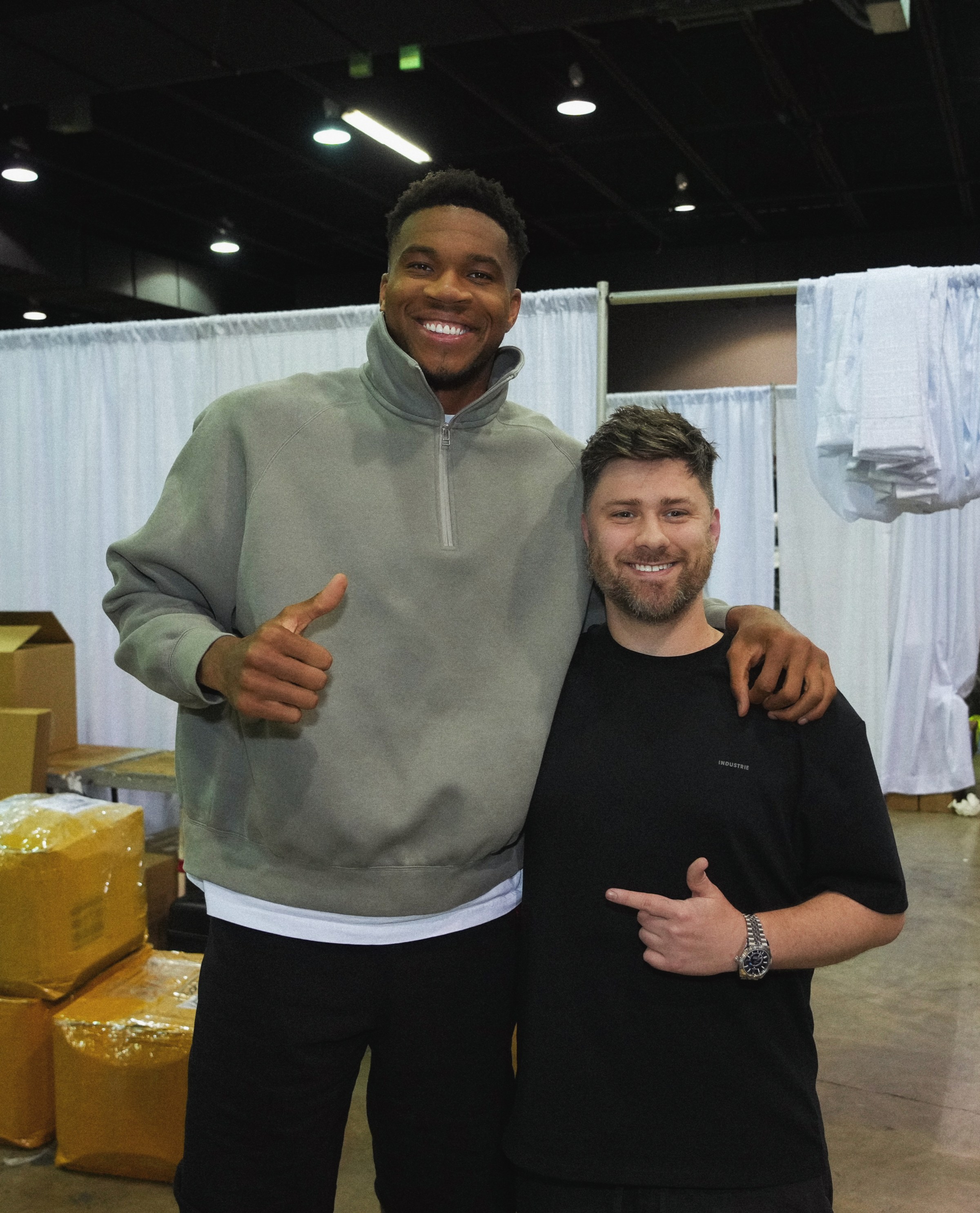 Titans colliding: Giannis Antetokounmpo and Tyson Beck link up at the official card signing.