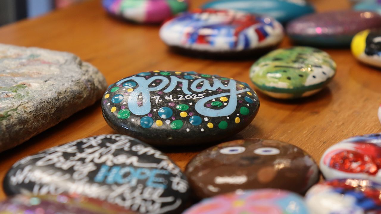 People from across the state and the country are sending in customized rocks to a shop in Kerrville. The rocks are being displayed in a rock memorial established by the shop as a way to honor those who died in Central Texas after the July 4 floods struck parts of the Texas Hill Country. (Spectrum News 1/Andres Rendon)
