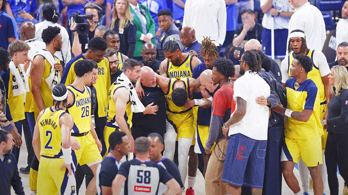 Indiana Pacers guard Tyrese Haliburton (0) is assisted after an apparent injury following a play against the Oklahoma City Thunder during the first half of game seven of the 2025 NBA Finals at Paycom Center.