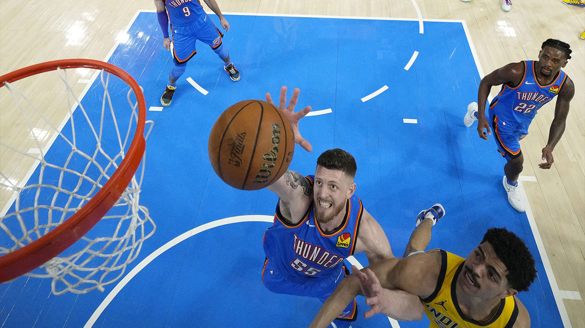 Oklahoma City Thunder center Isaiah Hartenstein (55) reaches for the ball against Indiana Pacers guard Ben Sheppard (26) during the second half of game seven of the 2025 NBA Finals at Paycom Center.