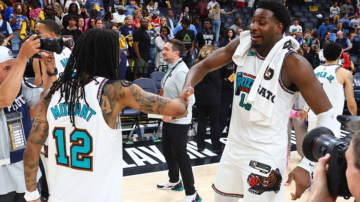 Memphis Grizzlies guard Ja Morant (12) and forward Jaren Jackson Jr. (13) react after defeating the Dallas Mavericks at FedExForum.