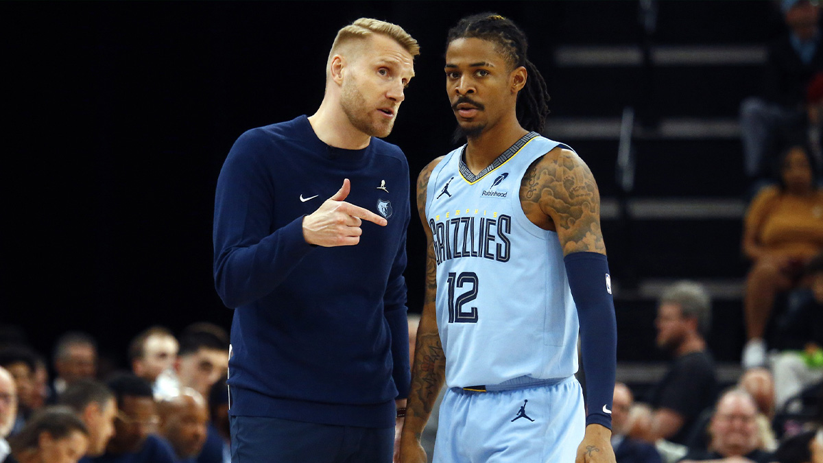 Memphis Grizzlies interim head coach Tuomas Iisalo talks with Memphis Grizzlies guard Ja Morant (12) during the third quarter against the Boston Celtics at FedExForum.
