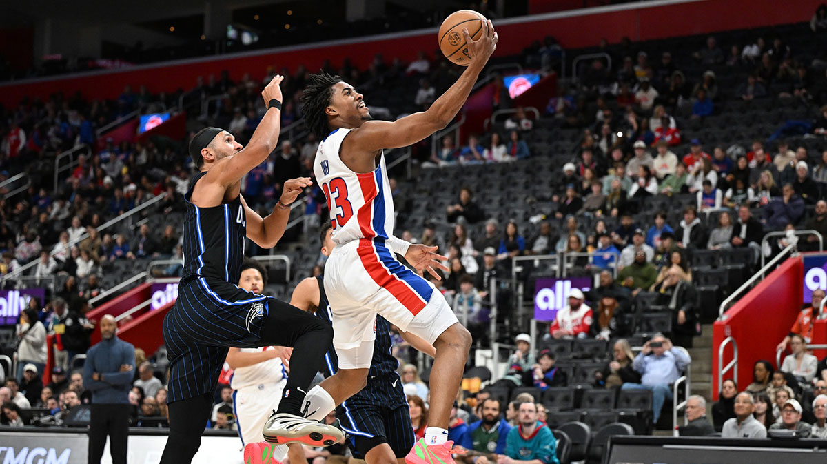 Detroit Pistons guard Jaden Ivey (23) drives past Orlando Magic guard Jalen Suggs (4) in the third quarter at Little Caesars Arena.