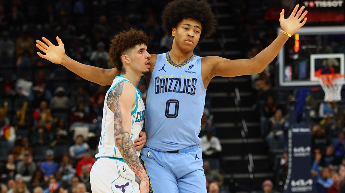 Jan 22, 2025; Memphis, Tennessee, USA; Charlotte Hornets guard LaMelo Ball (1) and Memphis Grizzlies forward Jaylen Wells (0) battle for position during the third quarter at FedExForum. Mandatory Credit: Petre Thomas-Imagn Images