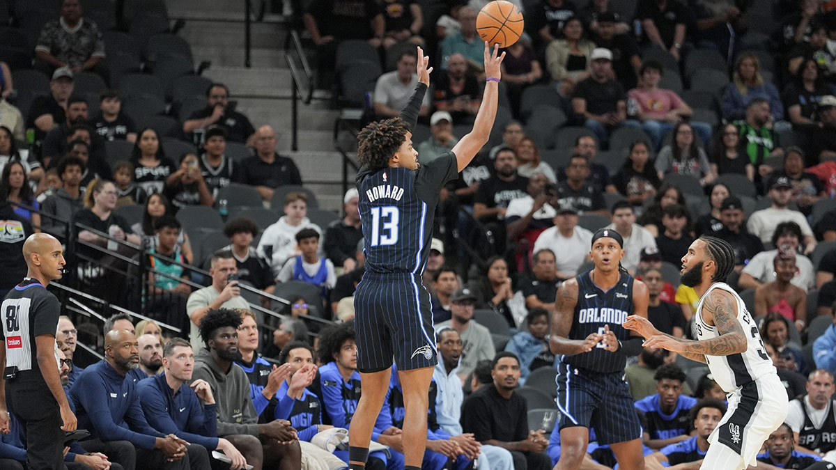 Orlando Magic guard Jett Howard (13) shoots over San Antonio Spurs forward Julian Champagnie (30) in the first half at Frost Bank Center.