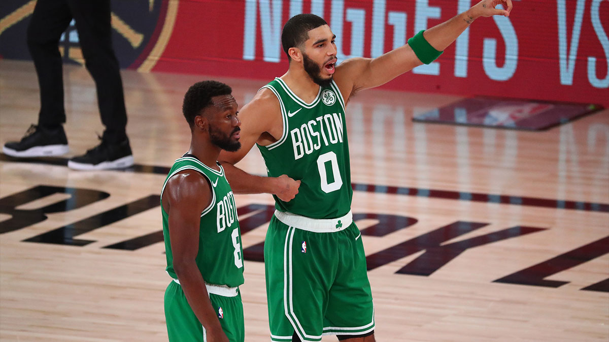 Boston Celtics guard Kemba Walker (8) and forward Jayson Tatum (0) react during the second half of game three of the Eastern Conference Finals of the 2020 NBA Playoffs against the Miami Heat at ESPN Wide World of Sports Complex.