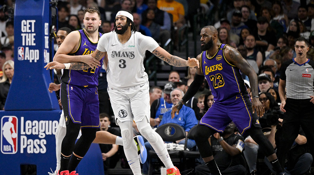 Los Angeles Lakers guard Luka Doncic (77) and forward LeBron James (23) and Dallas Mavericks forward Anthony Davis (3) in action during the game between the Dallas Mavericks and the Los Angeles Lakers at American Airlines Center.