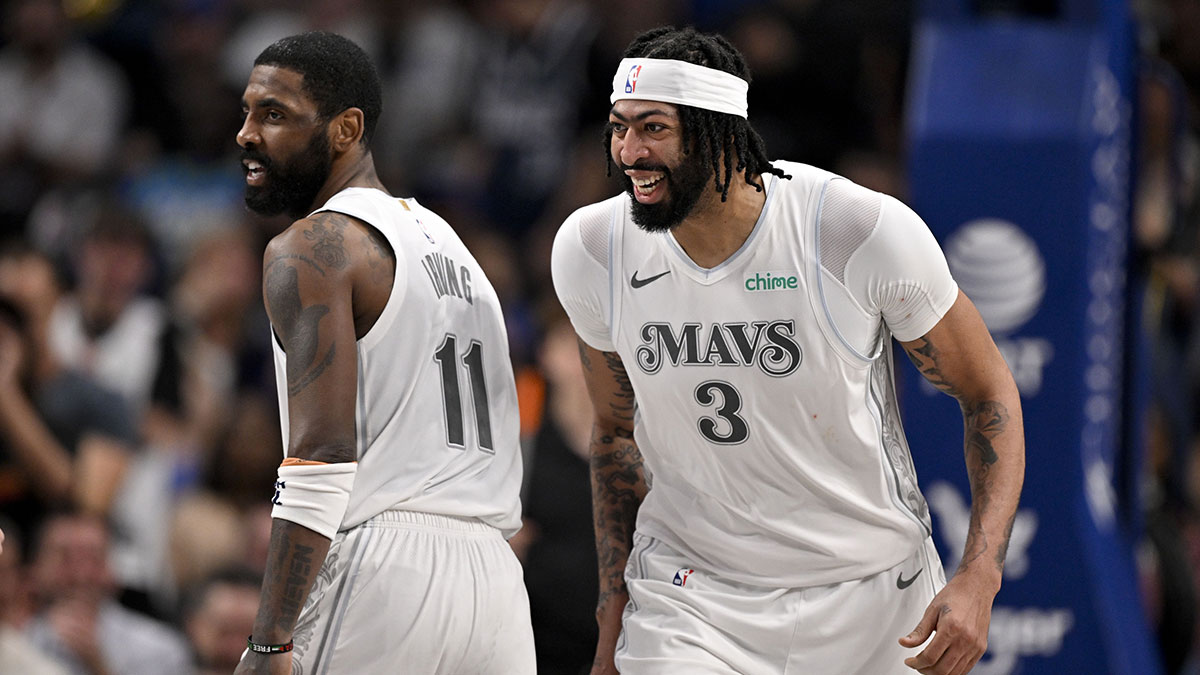 Mavericks forward Anthony Davis (3) and guard Kyrie Irving (11) celebrates after Davis dunks the ball during the game between the Dallas Mavericks and the Houston Rockets at the American Airlines Center