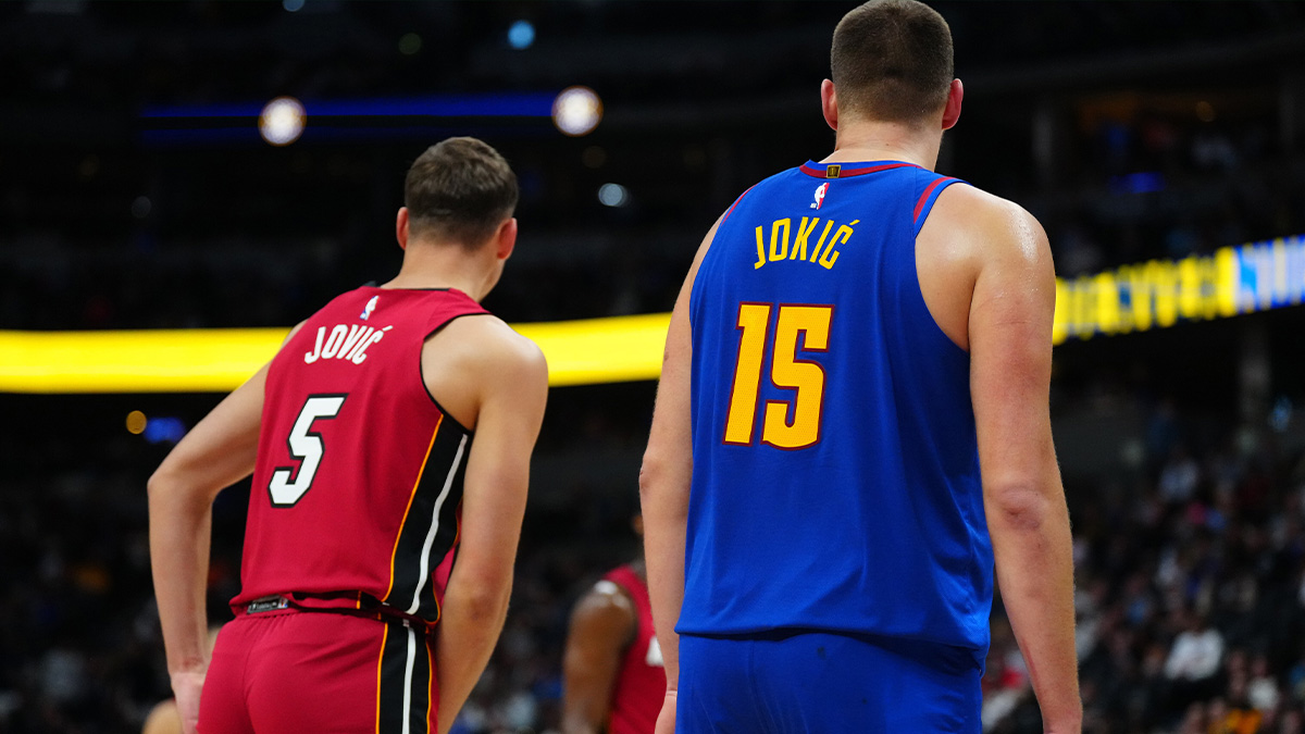 Miami Heat forward Nikola Jovic (5) and Denver Nuggets center Nikola Jokic (15) during the second half at Ball Arena.