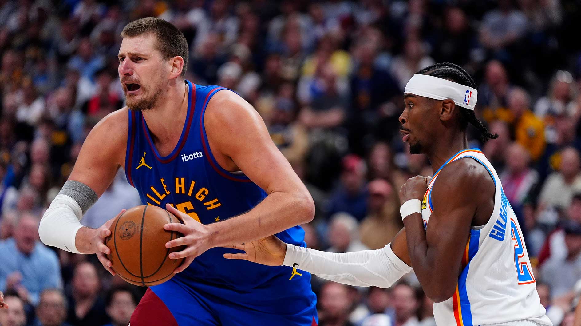 Oklahoma City Thunder guard Shai Gilgeous-Alexander (2) defends on Denver Nuggets center Nikola Jokic (15) in the second half during game three of the second round for the 2025 NBA Playoffs at Ball Arena.