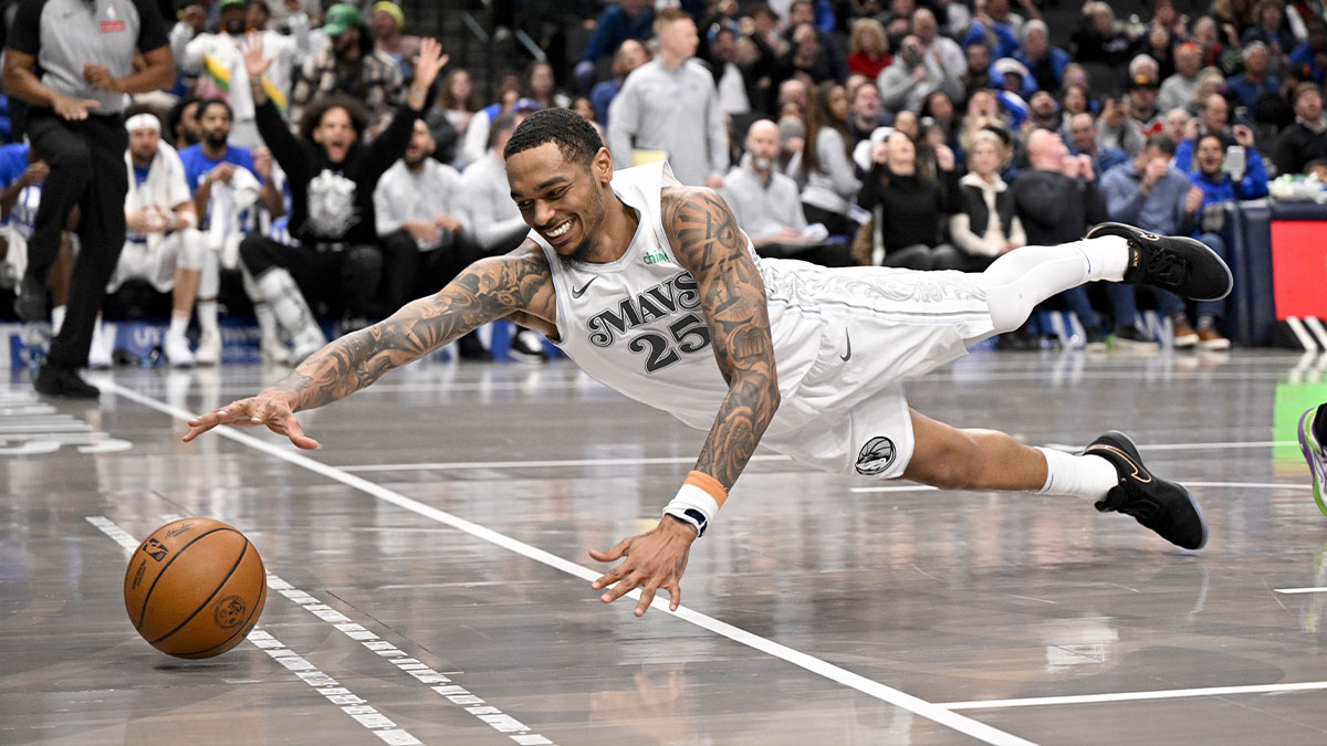 Dallas Mavericks forward P.J. Washington (25) dives for the ball during the second half against the New Orleans Pelicans at the American Airlines Center.