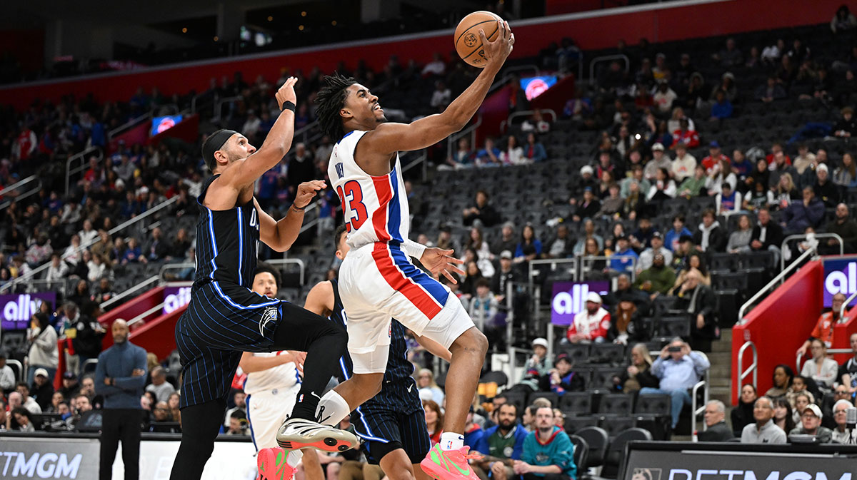 Detroit Pistons guard Jaden Ivey (23) drives past Orlando Magic guard Jalen Suggs (4) in the third quarter at Little Caesars Arena. 