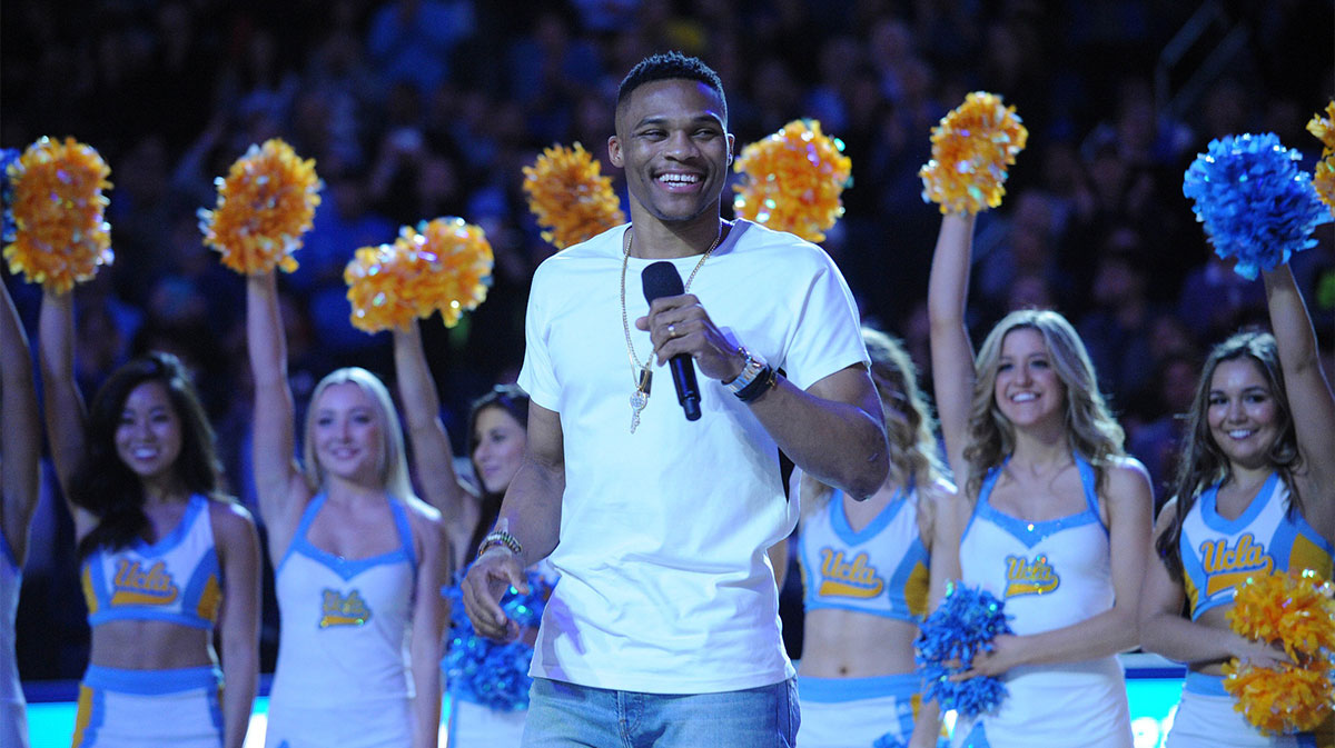 Former UCLA Bruins player Russell Westbrook speaks during halftime to spectators at Pauley Pavilion. Westbrook was recognized for his recent donation for the basketball practice facility under construction at UCLA.
