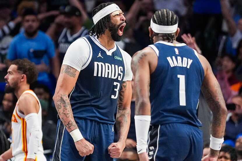 Dallas Mavericks forward Anthony Davis celebrates with guard Jaden Hardy (1) after dunking...