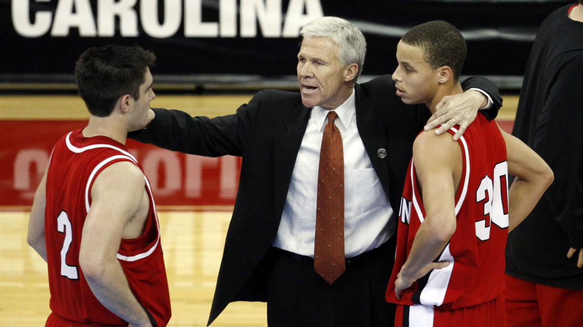 Davidson Wildcats head coach Bob McKillop talks to guards Stephen Curry (30) and Jason Richards (2) during the Wildcats 82-76 victory against the Gonzaga Bulldogs in the 1st round of the 2008 NCAA Mens Basketball Tournament the RBC Center.