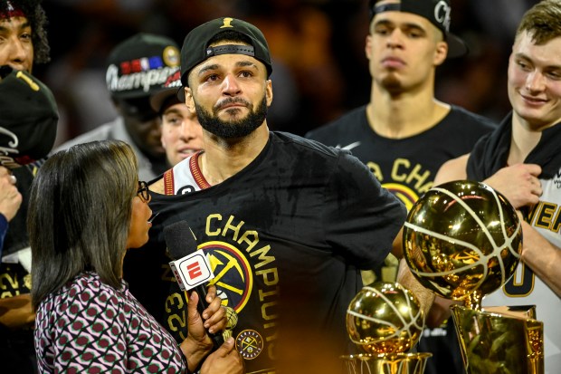Jamal Murray (27) of the Denver Nuggets cries on stage after the fourth quarter of the Nuggets' 94-89 NBA Finals clinching win over the Miami Heat at Ball Arena in Denver on Monday, June 12, 2023. (Photo by AAron Ontiveroz/The Denver Post)