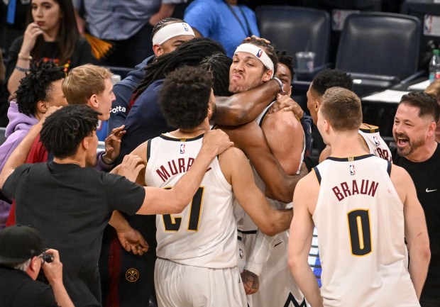 Aaron Gordon (32) of the Denver Nuggets sneers as teammates mob him after hitting a game-winning jumper over Chet Holmgren (7) of the Oklahoma City Thunder in the fourth quarter of the Nuggets' 121-119 win at Paycom Center in Oklahoma City, Oklahoma on Monday, May 5, 2025. The Nuggets took a 1-0 Western Conference semifinal lead with their win. (Photo by AAron Ontiveroz/The Denver Post)