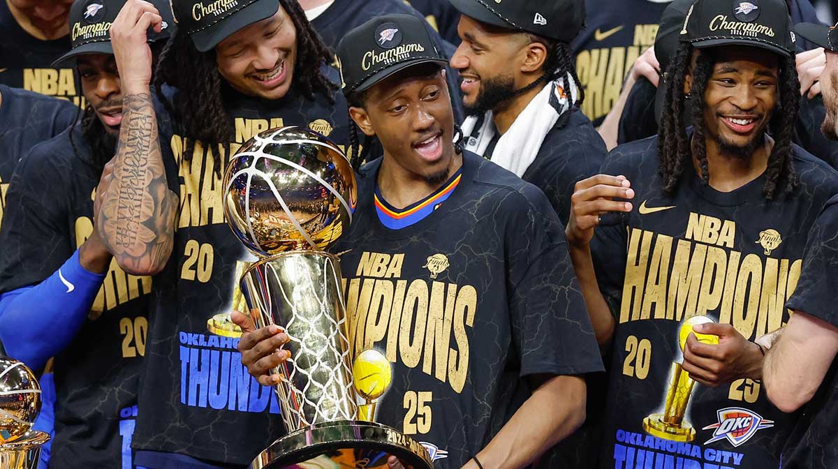 Thunder forward Jalen Williams (8) holds the NBA Larry O'Brien Championship Trophy at the end of game seven of the 2025 NBA Finals after defeating the Indiana Pacers at Paycom Center