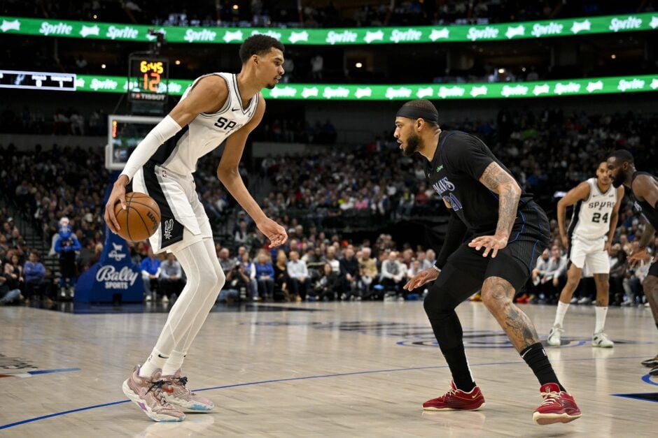 San Antonio Spurs center Victor Wembanyama dribbles against Dallas Mavericks center Daniel Gafford