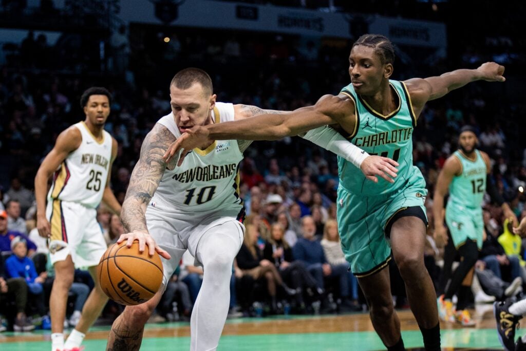 Jan 25, 2025; Charlotte, North Carolina, USA; New Orleans Pelicans center Daniel Theis (10) battles for the ball against Charlotte Hornets forward Moussa Diabate (14) during the first quarter at Spectrum Center. Mandatory Credit: Scott Kinser-Imagn Images