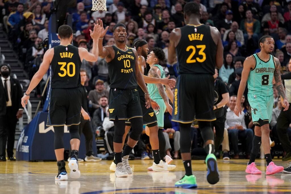 Golden State Warriors forward Jimmy Butler III (10) is congratulated by guard Stephen Curry 