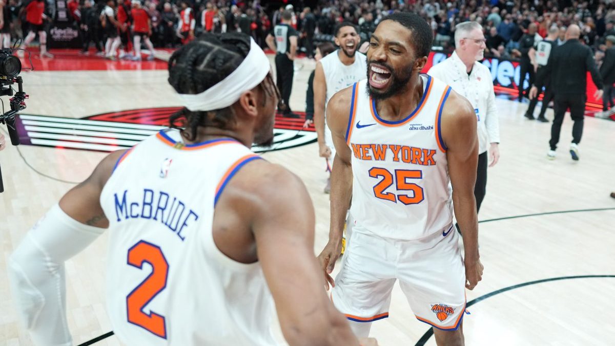 New York Knicks small forward Mikal Bridges (25) celebrates with point guard Miles McBride (2) after the game against the Portland Trail Blazers at Moda Center.