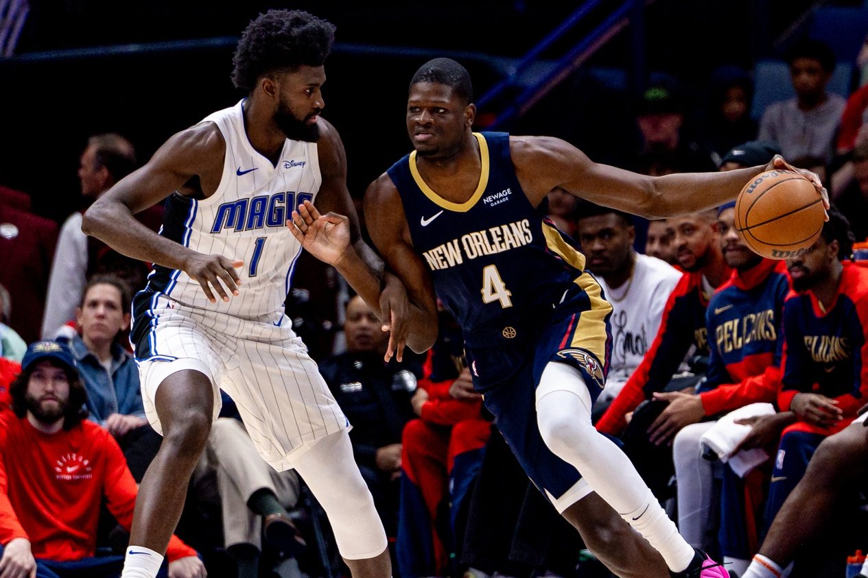 Mar 13, 2025; New Orleans, Louisiana, USA; New Orleans Pelicans center Mo Bamba (4) dribbles against Orlando Magic forward Jonathan Isaac (1) during the first half at Smoothie King Center. Mandatory Credit: Stephen Lew-Imagn Images