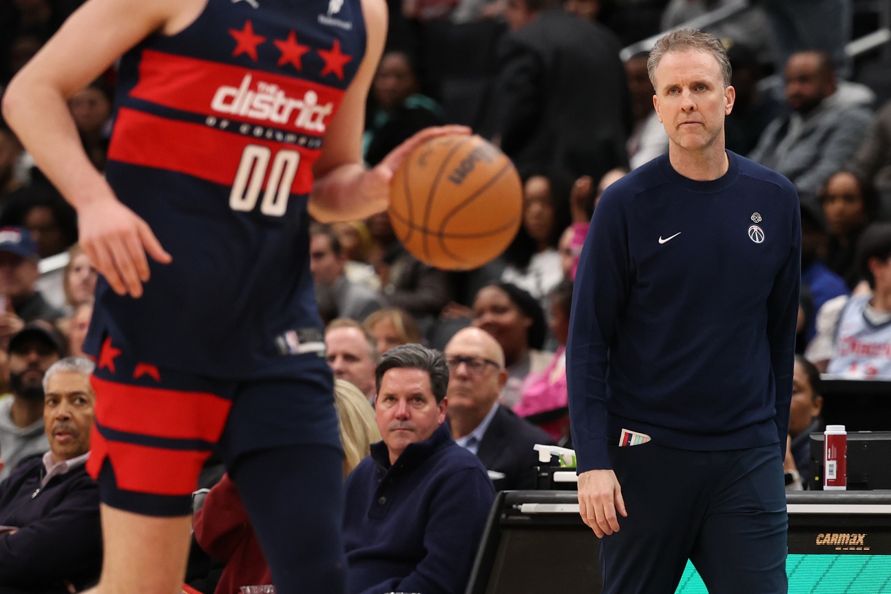 Apr 2, 2025; Washington, District of Columbia, USA; Washington Wizards head coach Brian Keefe (R) looks on from the bench against the Sacramento Kings in the second half at Capital One Arena. Mandatory Credit: Geoff Burke-Imagn Images
