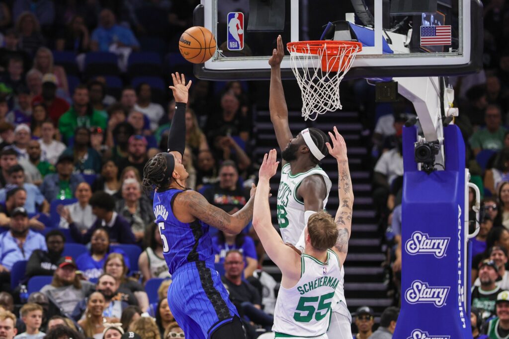 Apr 9, 2025; Orlando, Florida, USA; Boston Celtics center Neemias Queta (88) blocks a shot by Orlando Magic forward Paolo Banchero (5) during the second quarter at Kia Center. Mandatory Credit: Mike Watters-Imagn Images
