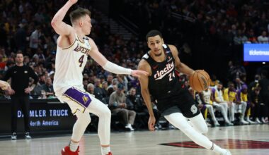 Apr 13, 2025; Portland, Oregon, USA; Portland Trail Blazers forward Kris Murray (24) dribbles the ball past Los Angeles Lakers guard Dalton Knecht (4) in the first half at Moda Center. Mandatory Credit: Jaime Valdez-Imagn Images