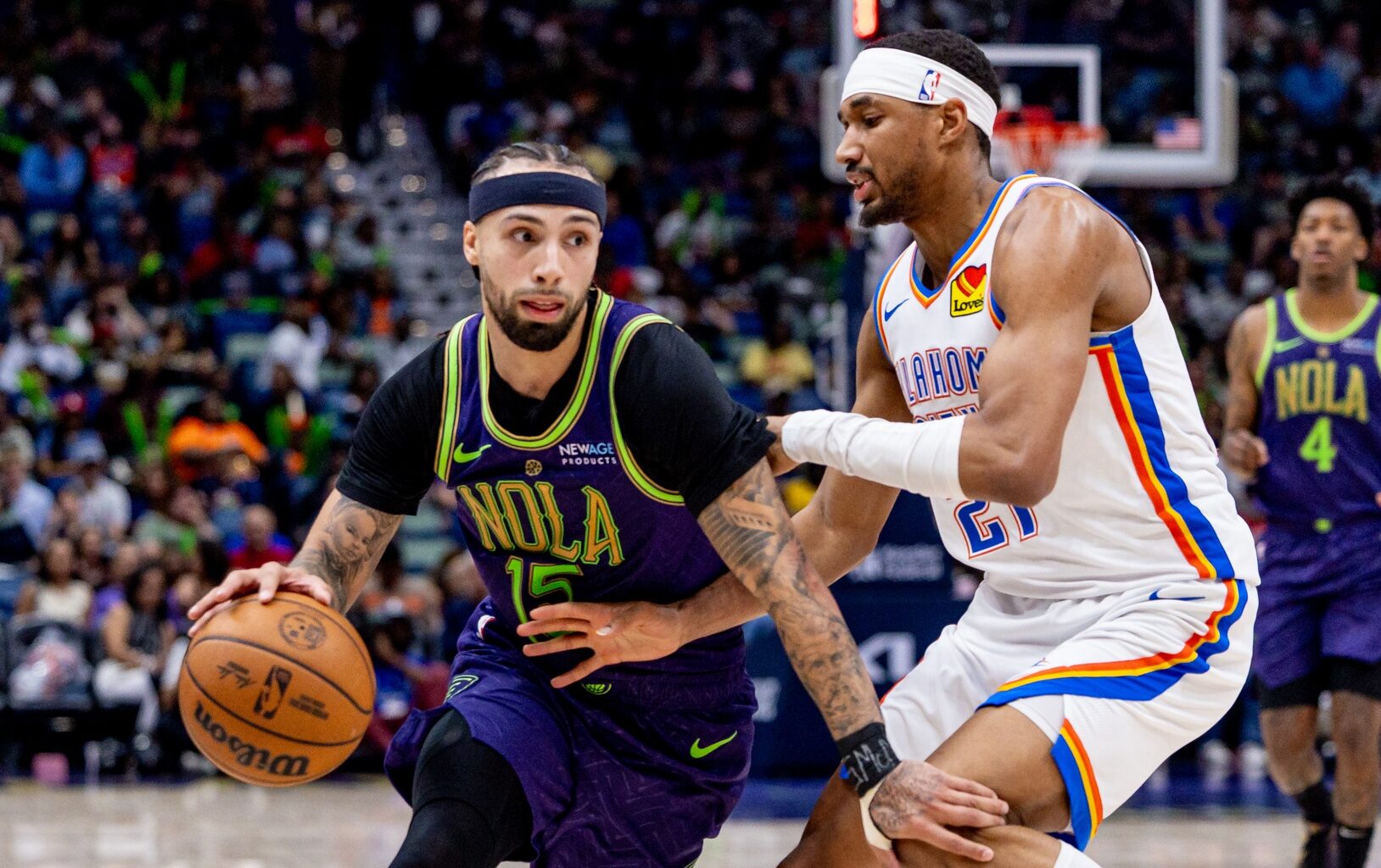 Apr 13, 2025; New Orleans, Louisiana, USA; New Orleans Pelicans guard Jose Alvarado (15) dribbles against Oklahoma City Thunder guard Aaron Wiggins (21) during the second half at Smoothie King Center. Mandatory Credit: Stephen Lew-Imagn Images
