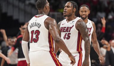 Miami Heat forward Bam Adebayo and guard Davion Mitchell chest bump