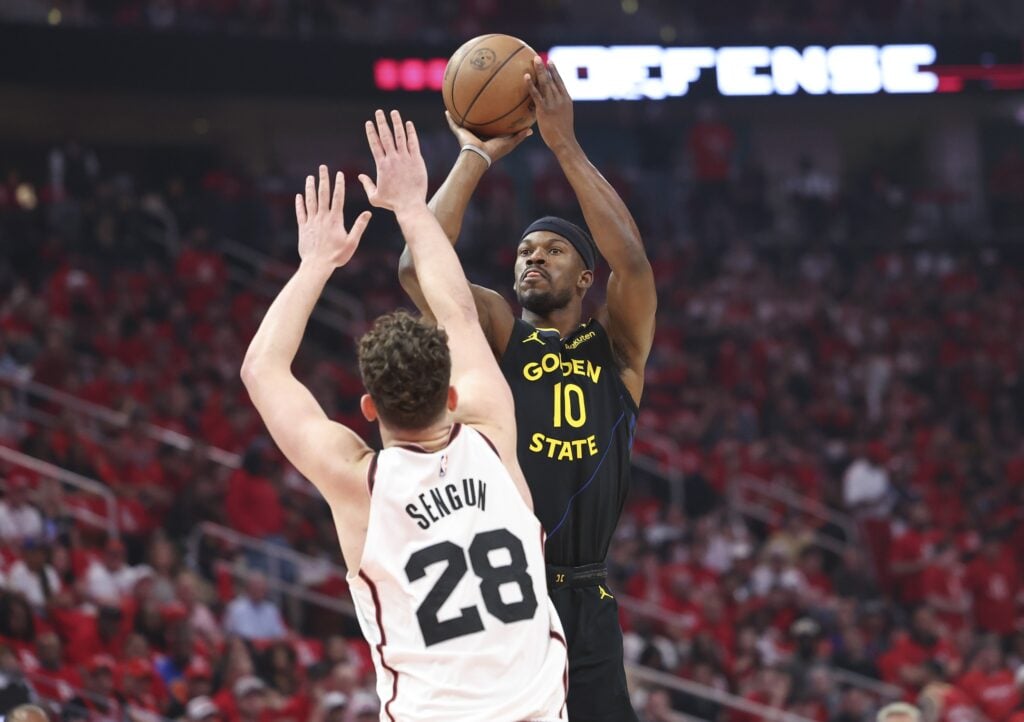 May 4, 2025; Houston, Texas, USA; Golden State Warriors forward Jimmy Butler III (10) shoots the ball over Houston Rockets center Alperen Sengun (28) during game seven of first round for the 2025 NBA Playoffs at Toyota Center. Mandatory Credit: Troy Taormina-Imagn Images