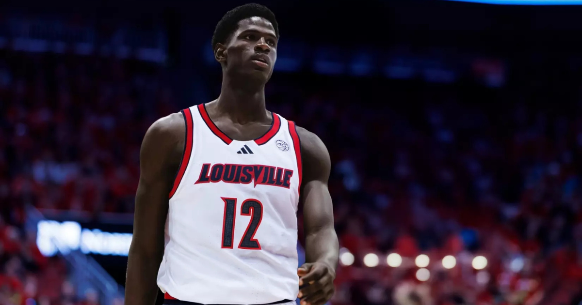 Jan 14, 2025; Syracuse, New York, USA; Louisville Cardinals assistant coaches Brian Kloman (standing) and Mike Cassidy give instructions to forward Khani Rooths (9) and guard Reyne Smith (6) and forward James Scott (0) before entering the game in the second half against the Syracuse Orange at the JMA Wireless Dome. Mandatory Credit: Mark Konezny-Imagn Images