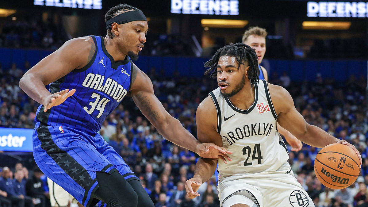 Orlando Magic center Wendell Carter Jr. (34) defends Brooklyn Nets guard Cam Thomas (24) during the second quarter at Kia Center.