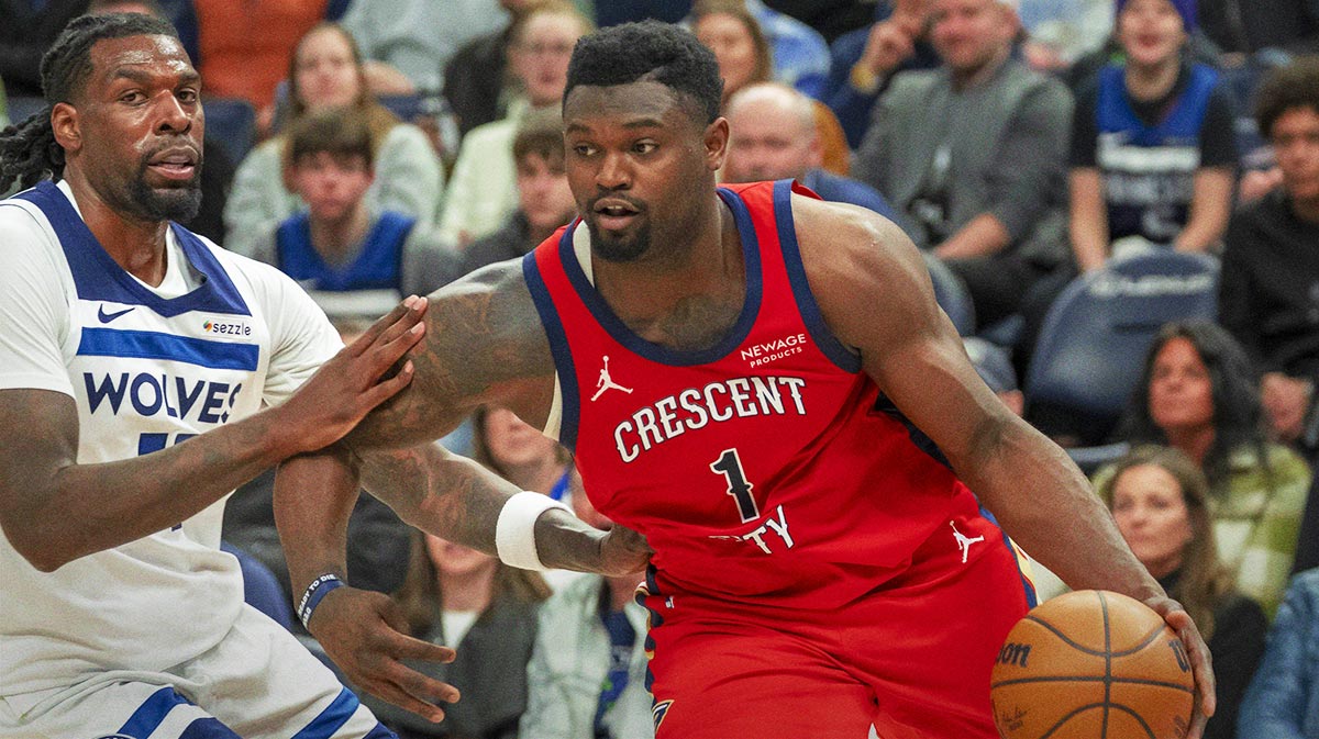 New Orleans Pelicans forward Zion Williamson (1) drives to the basket past Minnesota Timberwolves center Naz Reid (11) in the second half at Target Center.